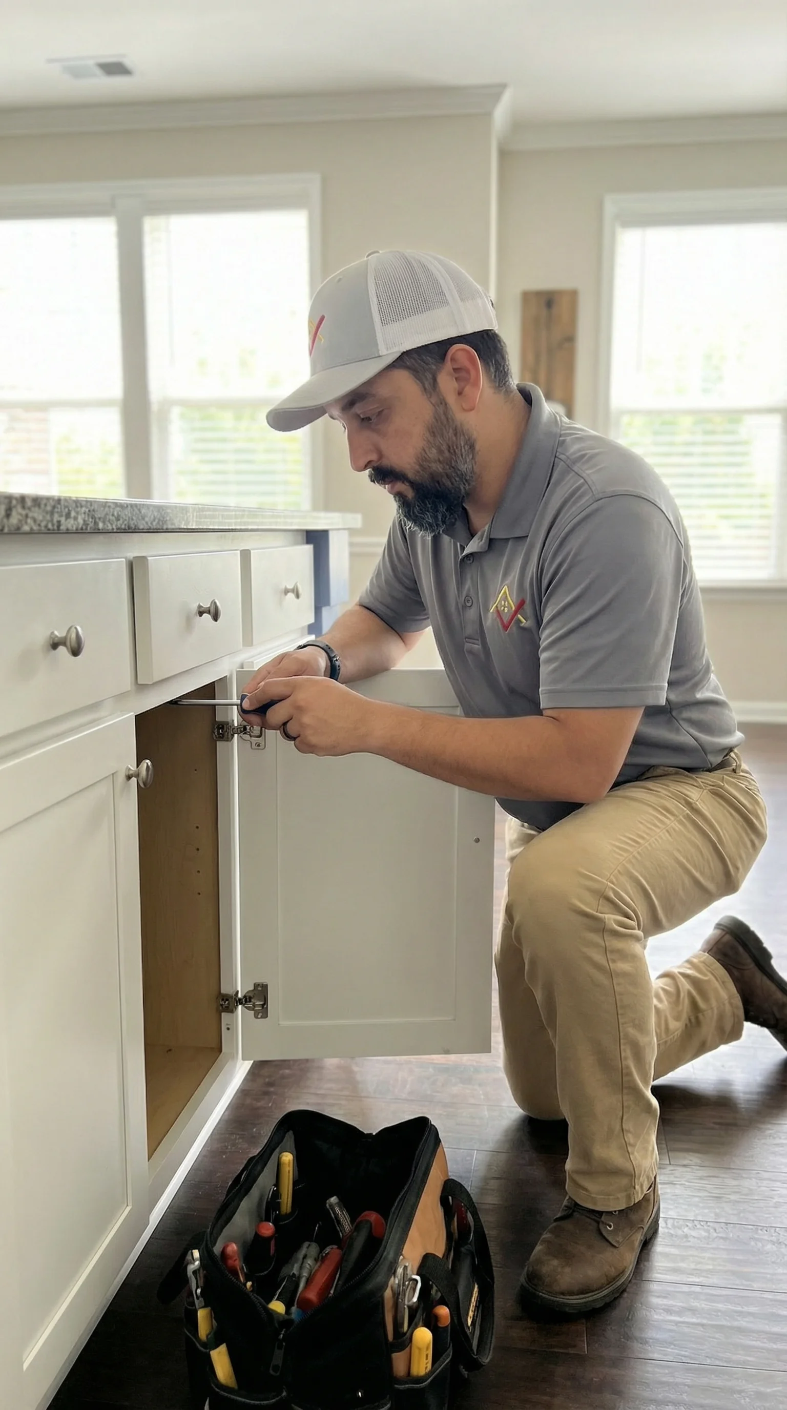 Technician Repairing Cabinet Hinge