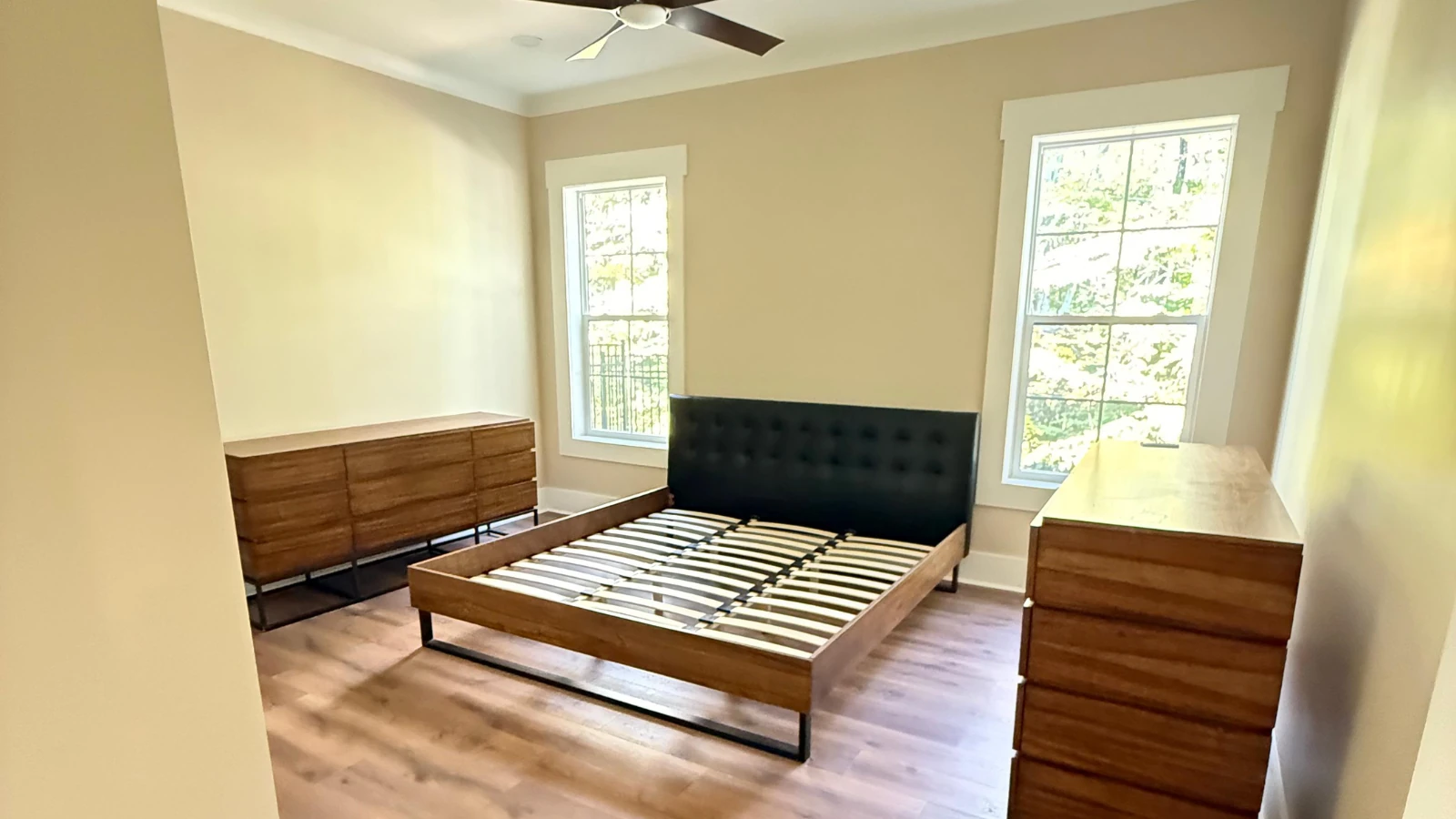 Bedroom with Bed and Wood Dressers